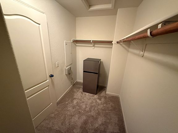 Walk-in closet with mini fridge