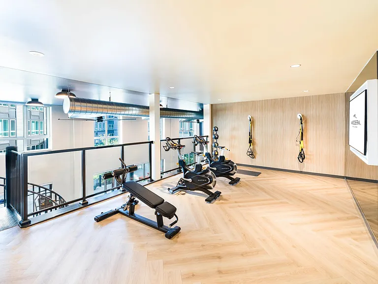 Recharge in Modera Beaverton's light-filled fitness studio, designed for focused workouts.