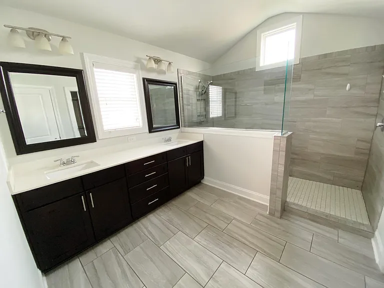 Oversized tiled shower, dual vanities