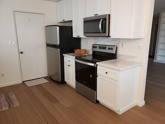 New Stove, Microwave, The countertops (quartzite), and Cupboards