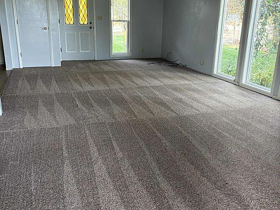 New carpets - shown front entry and living room area.