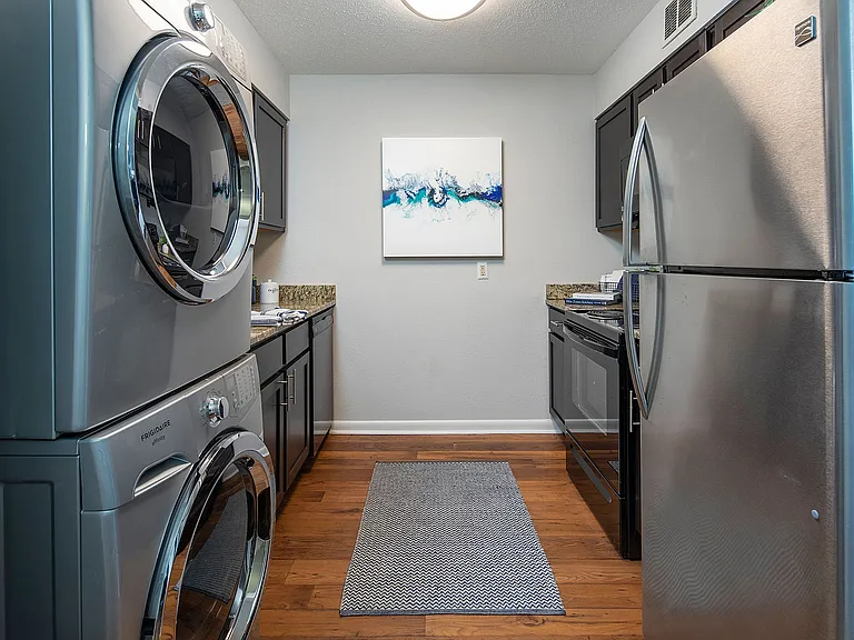 Experience the convenience of modern living with this stylish kitchen equipped with top-of-the-line appliances.