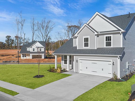 Exclusive DRB Homes exterior with balanced proportions and vibrant curb appeal