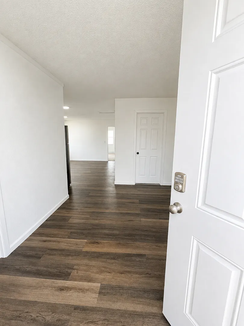 Elevated 3-Bedroom Home with Secure Garage & Cozy Living Space — Photo 3