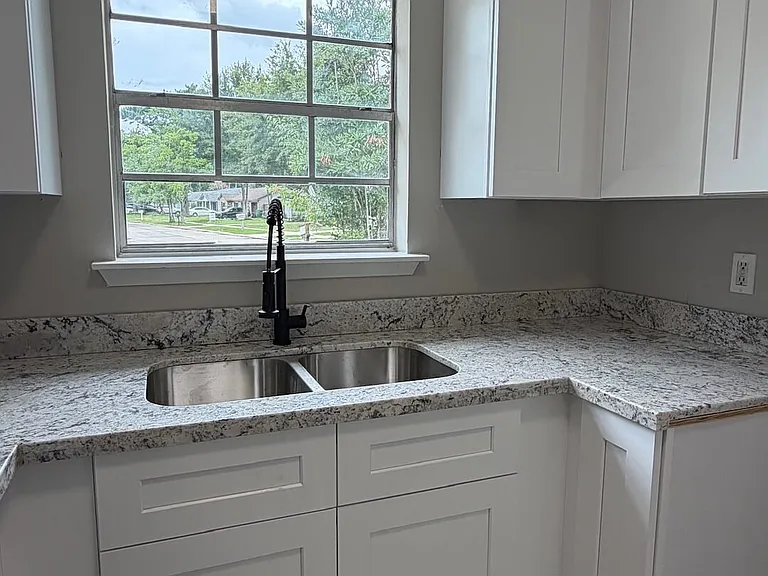 New Kitchen Renovation:
Granite Countertops and Stainless Steel Appliances