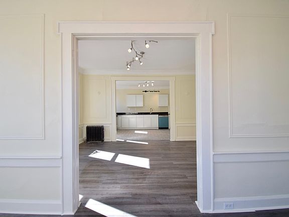 Sunroom looking through living room towards kitchen