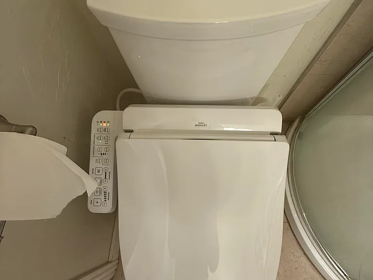 The toilet is upgrades with seat warmer.