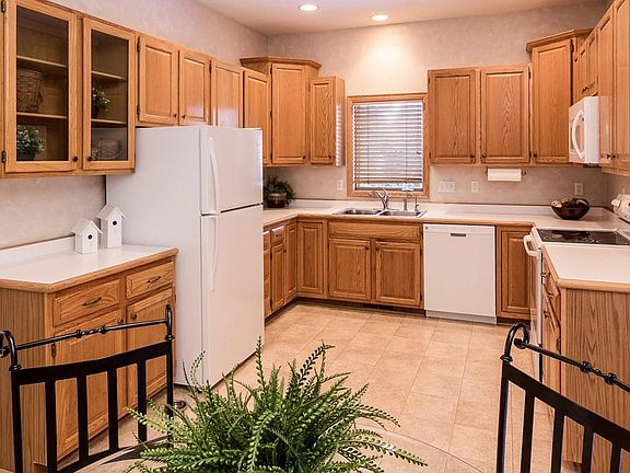 Nice size kitchen with plenty of cabinet space, newer refrigerator and kitchen window