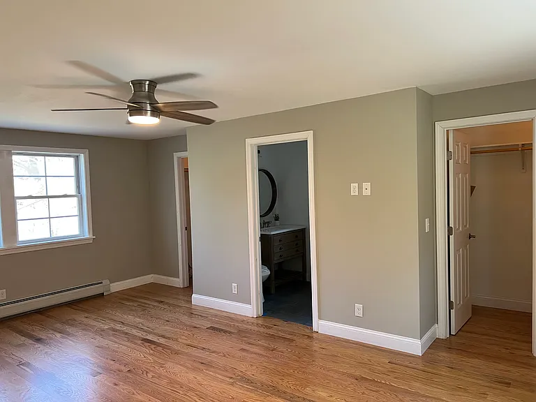 Oversized primary bedroom with en suite bathroom and 2 walk-in closets