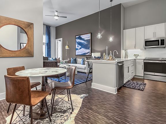 Hardwood-style flooring in kitchen, living and dining room