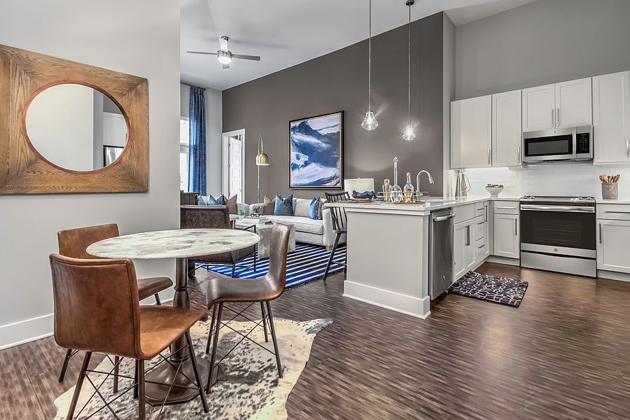 Hardwood-style flooring in kitchen, living and dining room