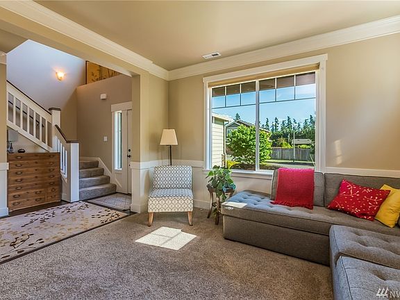 Another View of Living Room. Notice the Detailed Trim with Crown Moulding & Wainscot with Chair Rail.