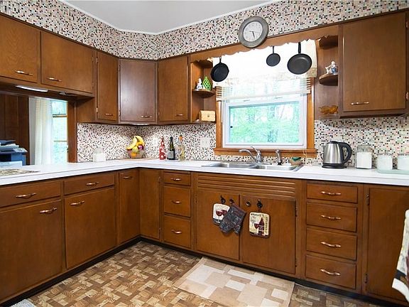 Kitchen in the principal residence. Original birch cabinets.
