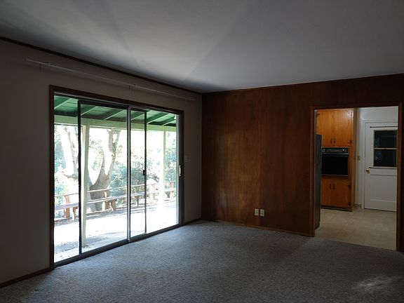 Flexible living room layout with neutral finishes, soft natural light, and a quiet, grounded feel well suited for everyday living.