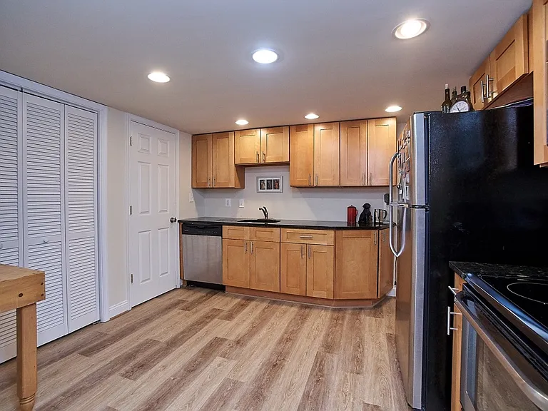 Stainless steel appliances and modern cabinets