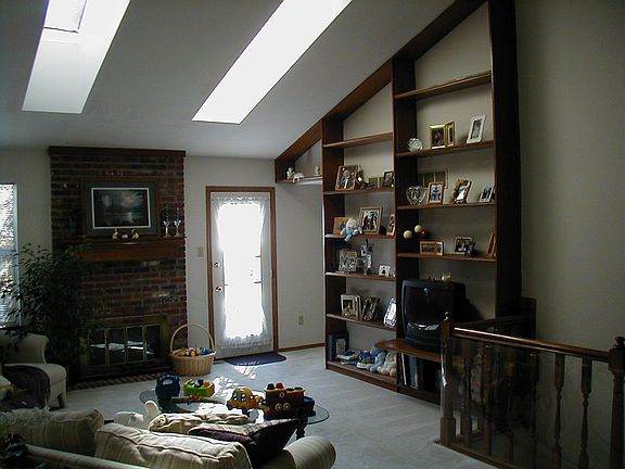 Great room with vaulted cieling and skylights.
