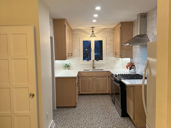 Newly renovated chefs kitchen with gas range.