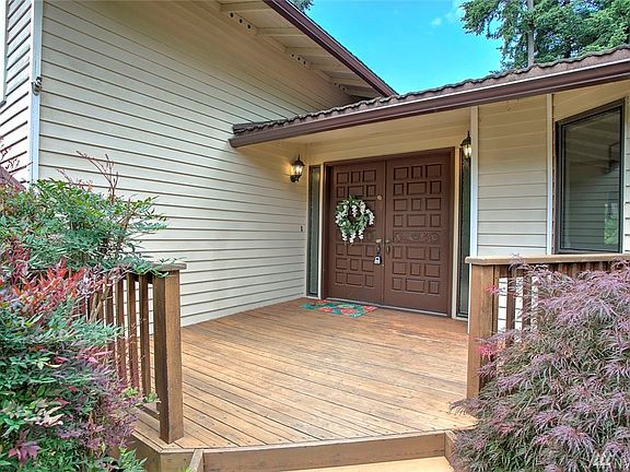 A large front deck welcomes you into this lovely home.