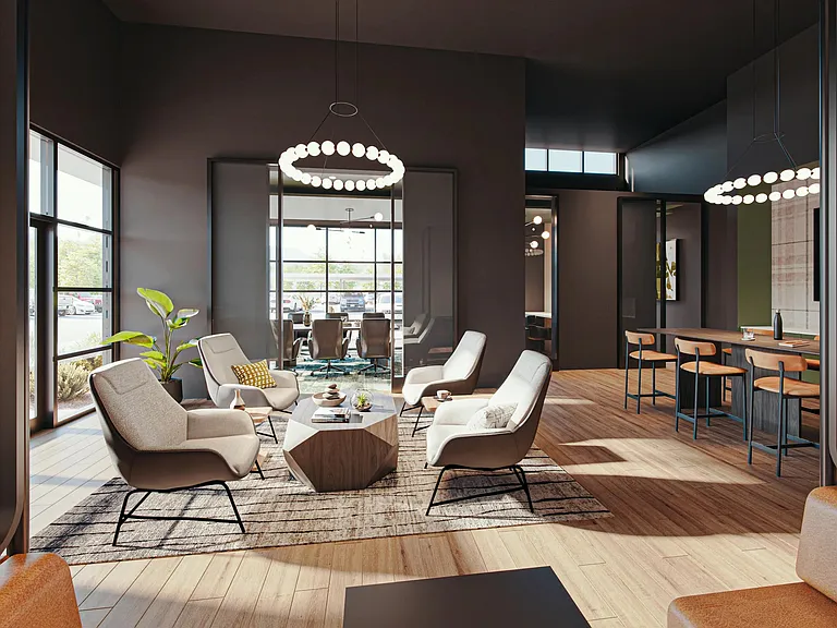A refined coworking lounge with intimate seating, warm finishes, and space to gather or unwind.