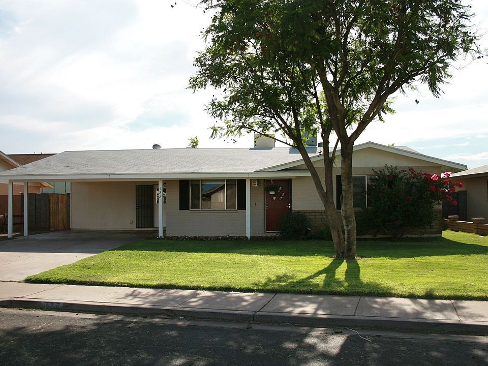 Cozy ranch-style home with mature landscaping and modern conveniences