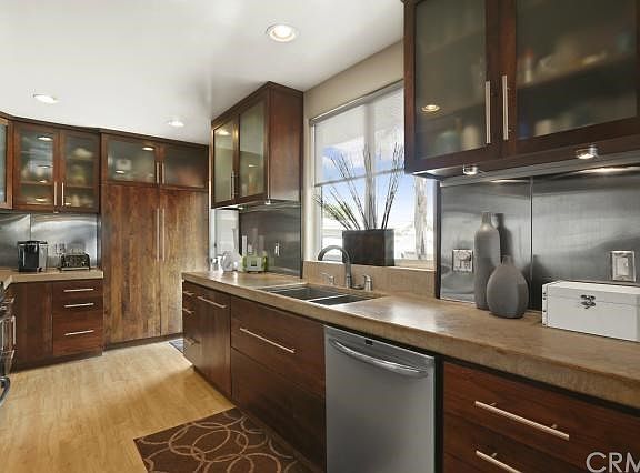 Kitchen boasts plenty of concrete counters and storage