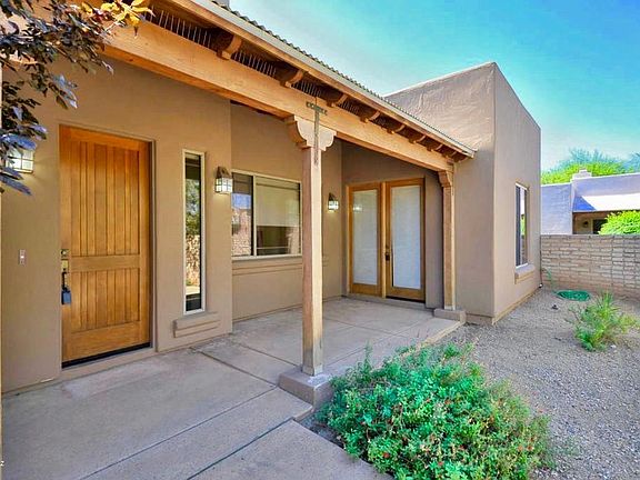 Front covered patio large enough for dining set!