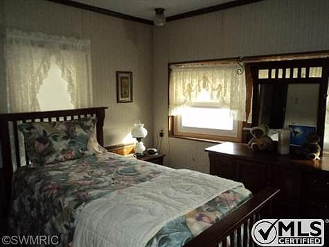 Master bedroom has lots of windows and closet space.