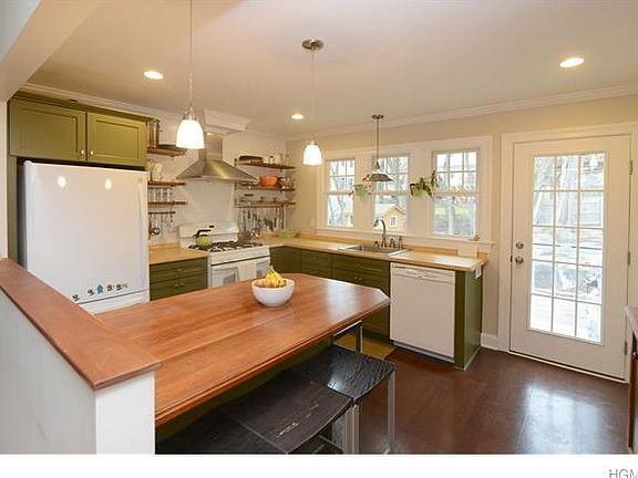 Light and bright kitchen with door out to patio for great outdoor entertaining.