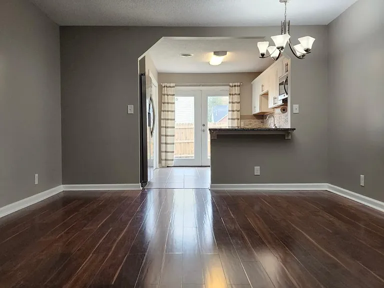 Living Room to Kitchen to Backyard View