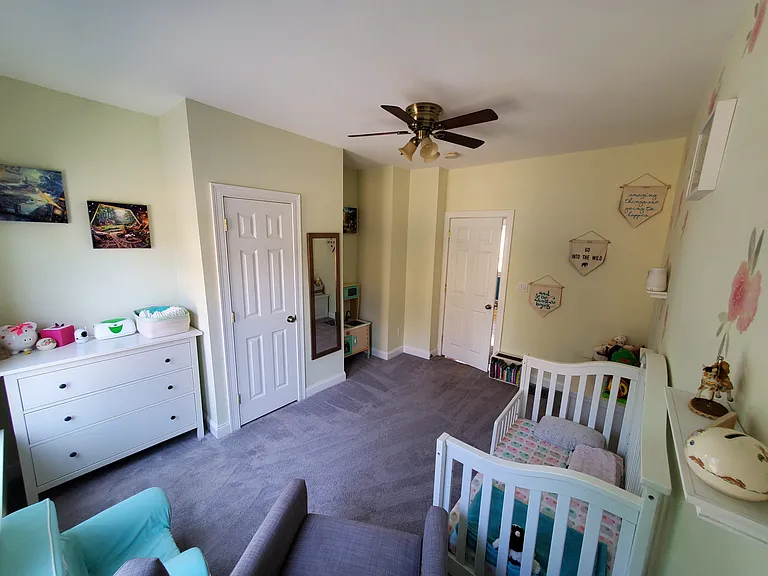 Bedroom 2 with walk in closet and ceiling fan