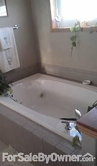 Master Bath
						:
						Jacuzzi tub fits two.
