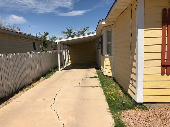 Car-port provides great shade and easy access to back or front entrances