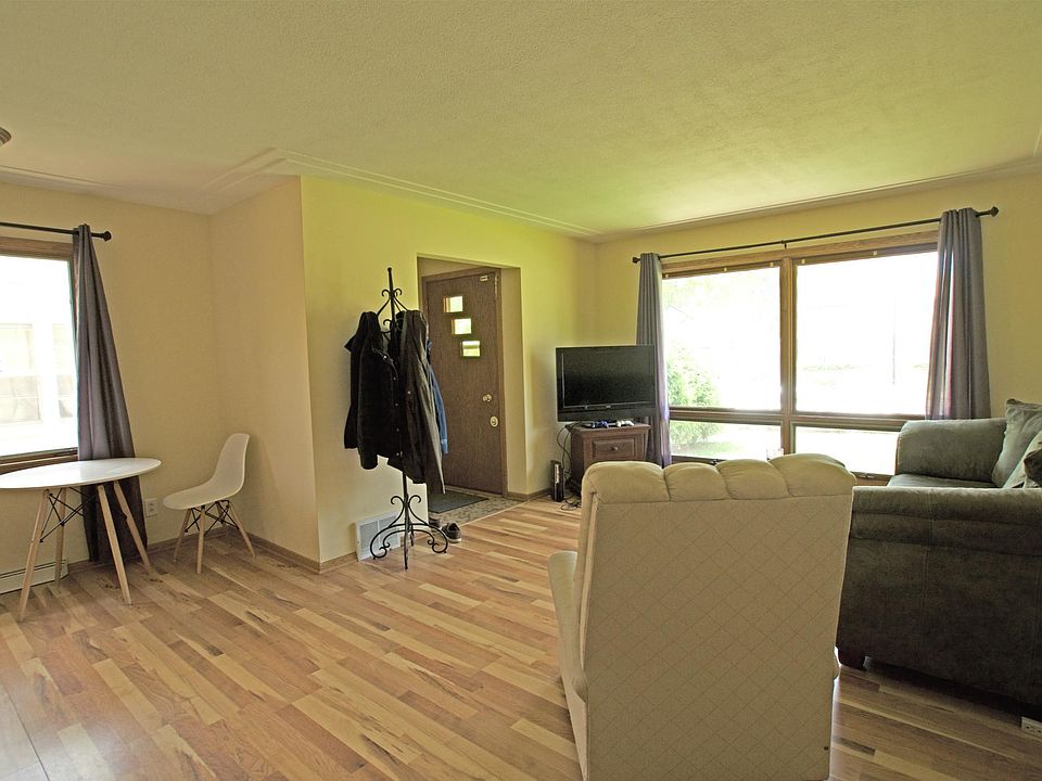Living room with large window letting abundant natural light