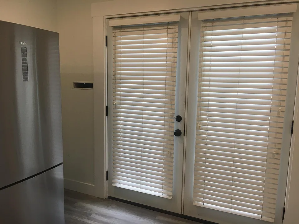 Kitchen, french doors open to 10'x10' deck outside.