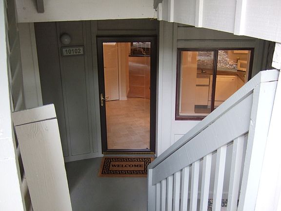 Step inside this total renewed condo - looking thru the pella full glass door