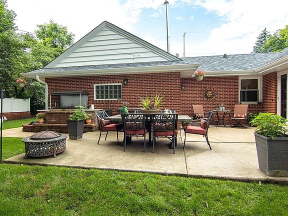 Back patio with outdoor furnished, bar, grill, Grill/Spit, and herb garden