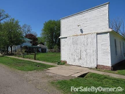 Shop/ garage (northeast corner)
						:
						house in background