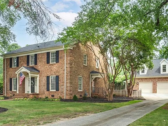 House, fenced yard, and detached 2 car garage with bonus space