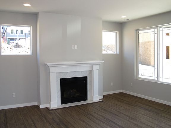 Light-filled gathering room centers around the interior fireplace