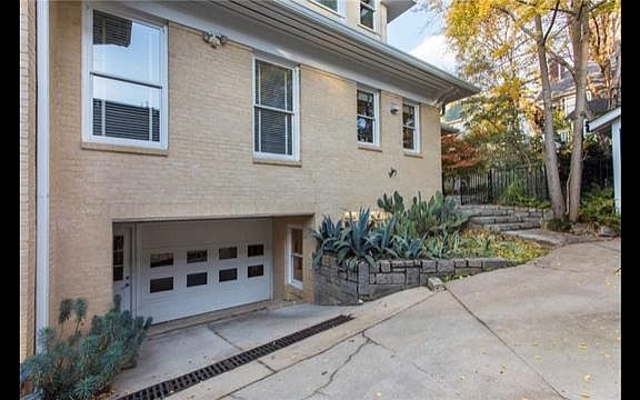 Private entrance seen at bottom left of photo. Garage space is not used for cars.