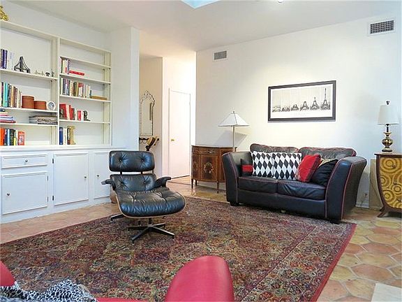 Lovely built-ins grace the living space too! Saltillo tile floor!