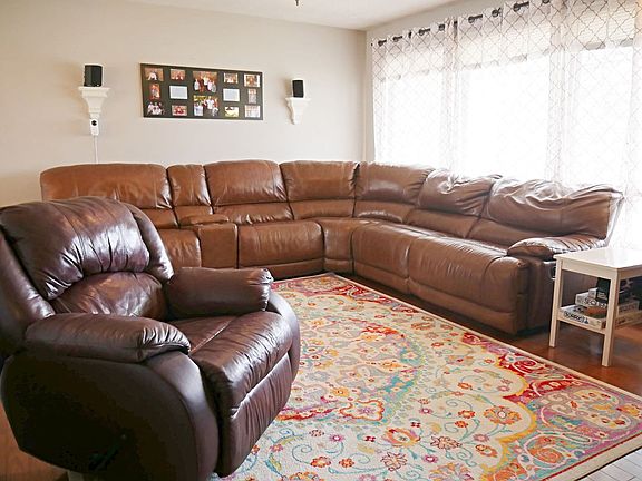 A very large family room greets you as you come in the front door.