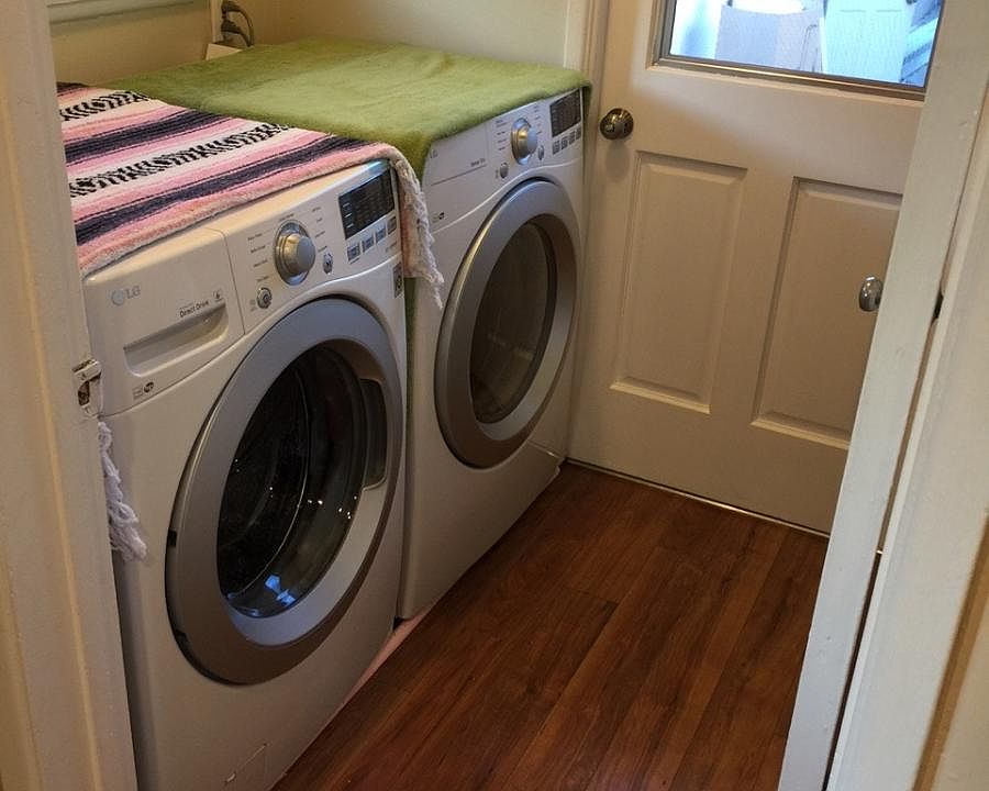 Laundry room next to kitchen