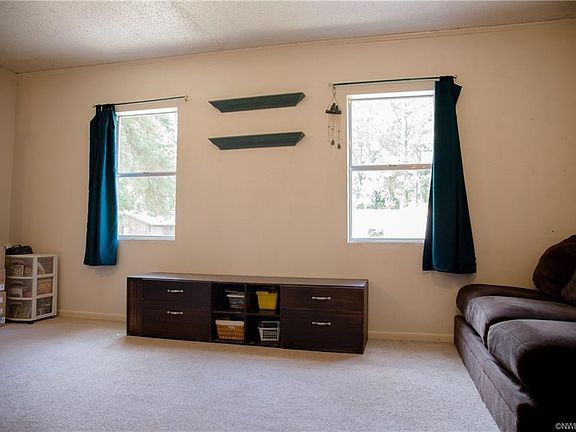 The converted carport is now a large den used as a kids' play room and TV room.