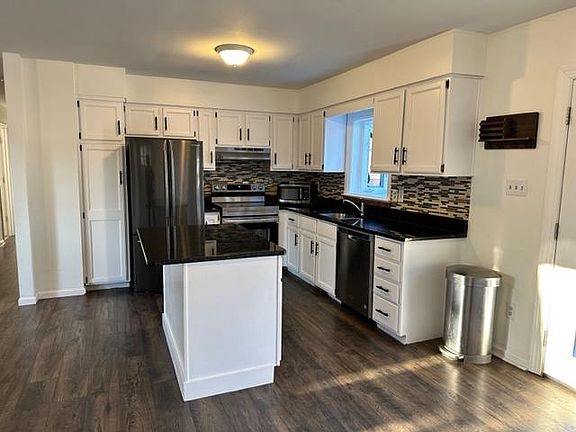 Kitchen with stainless steel appliances and granite counter tops