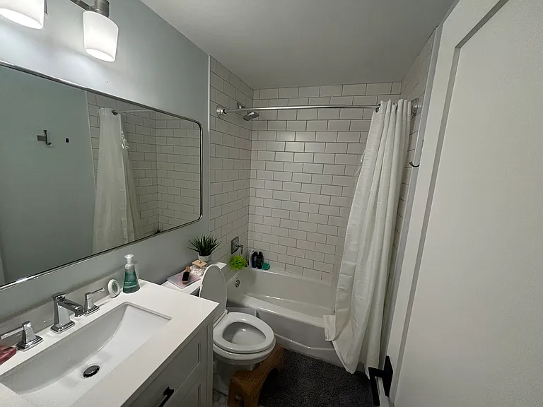 Upper floor main bathroom between bedrooms and primary bedroom. Next to laundry room. Top of stair case.