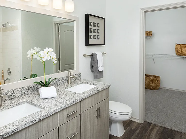 Upgraded bathrooms with framed mirrors, double vanities and undermount sinks