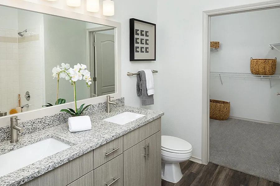Upgraded bathrooms with framed mirrors, double vanities and undermount sinks
