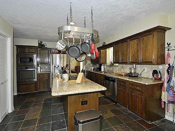 Gorgeous updated kitchen with granite & stainless appliances