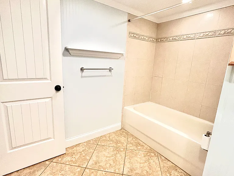 Guest bathroom with tub and shower